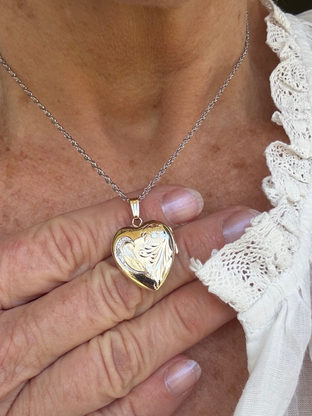 Heart Shaped Locket, 10kt Yellow gold with a small Diamond set in White Gold.